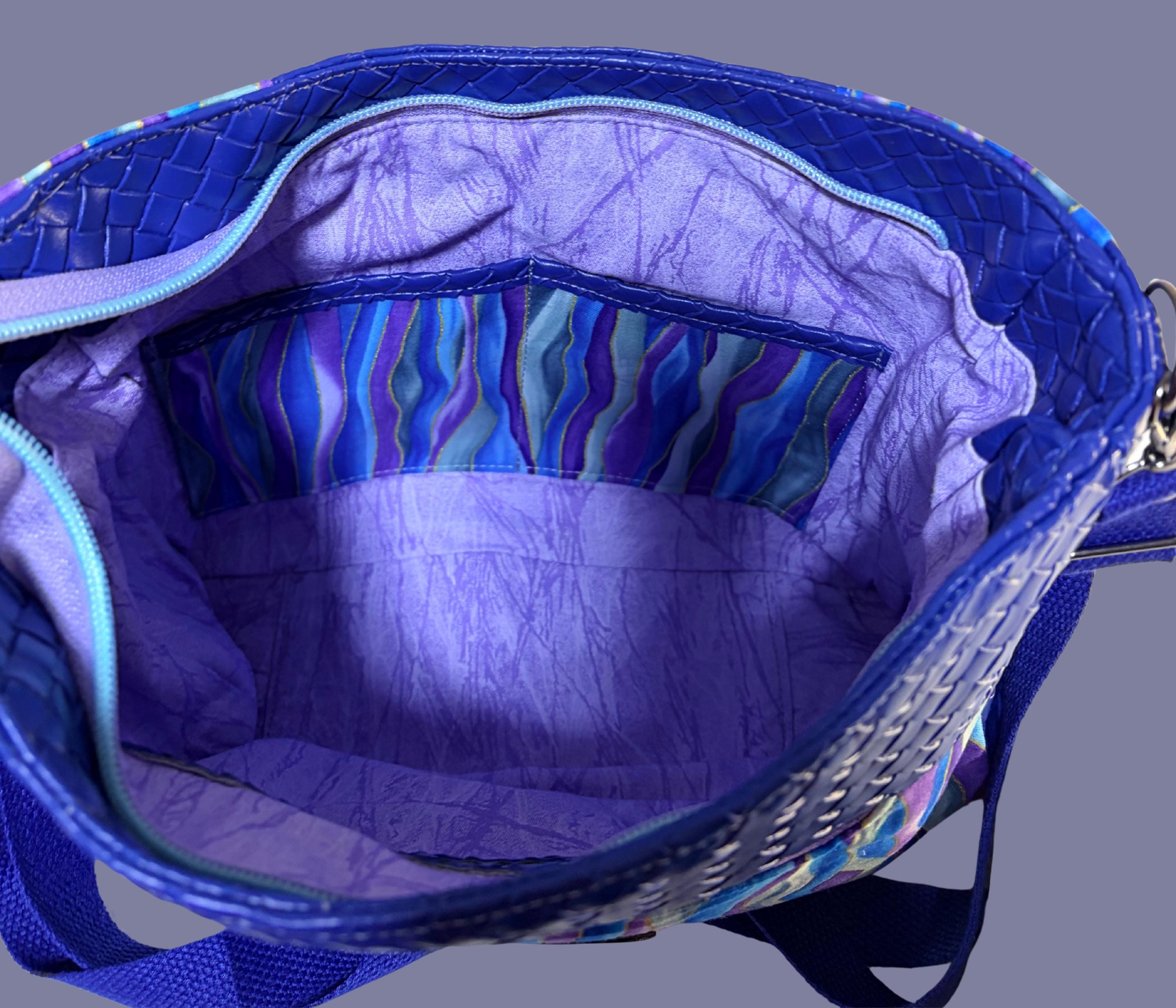 Blue Crossbody Bag with Zipper Pockets and Purple Bow Pull