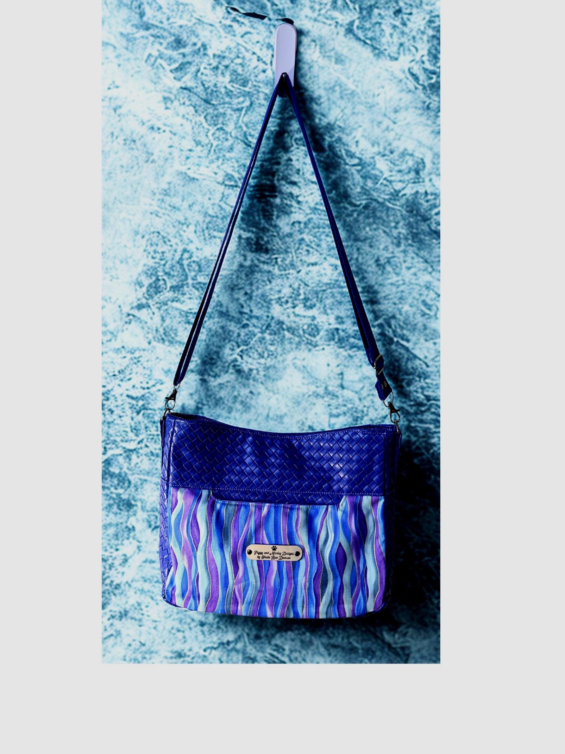 Blue Crossbody Bag with Zipper Pockets and Purple Bow Pull